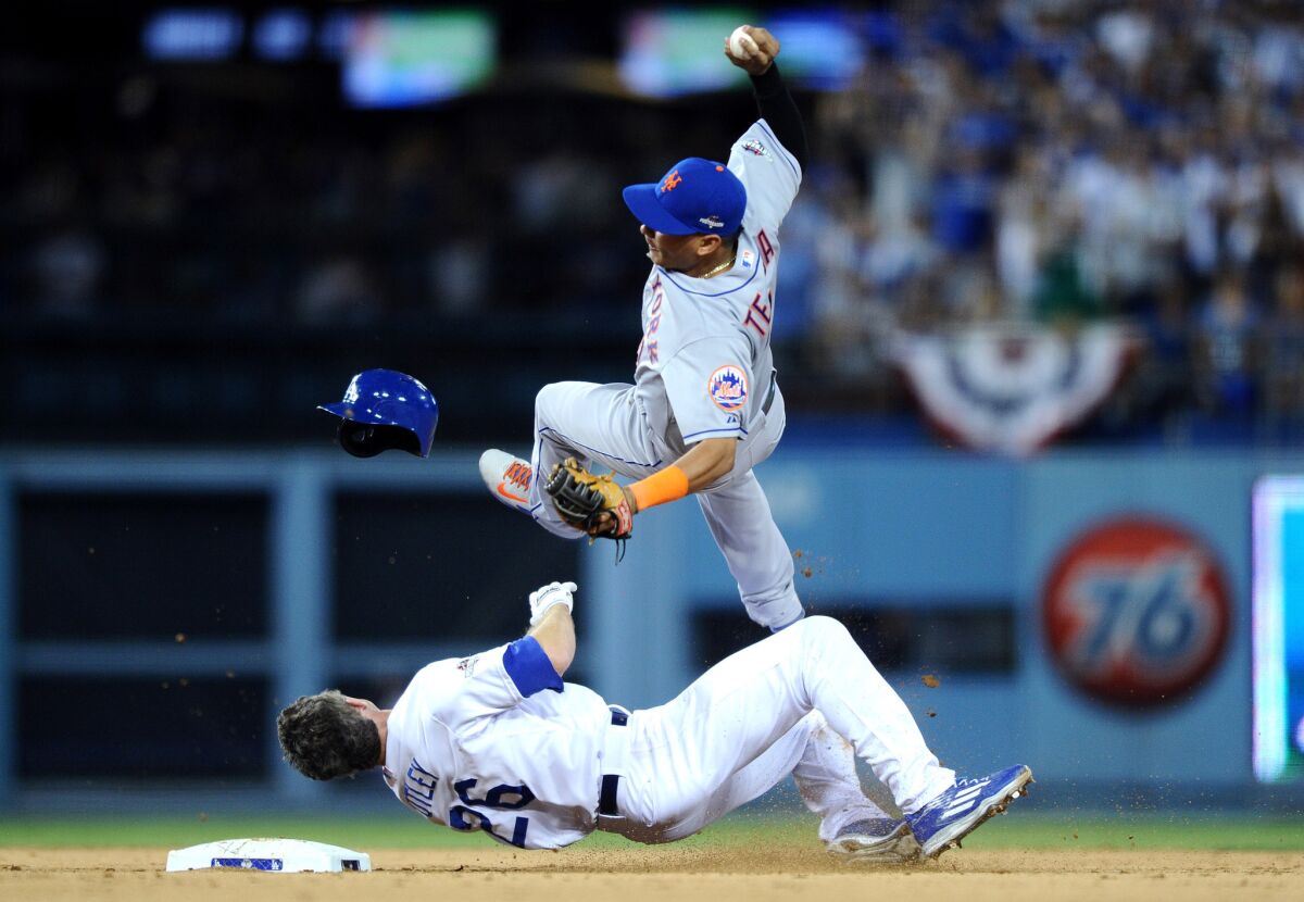 Dodgers second baseman Chase Utley upends Mets shortstop Ruben Tejada to break up a double play in the seventh inning in Game 2 of the NLDS.