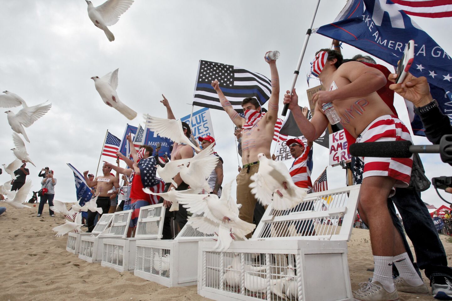Doves are released at the start of the Make America Great Again March at Bolsa Chica State Beach in Huntington Beach on Saturday.