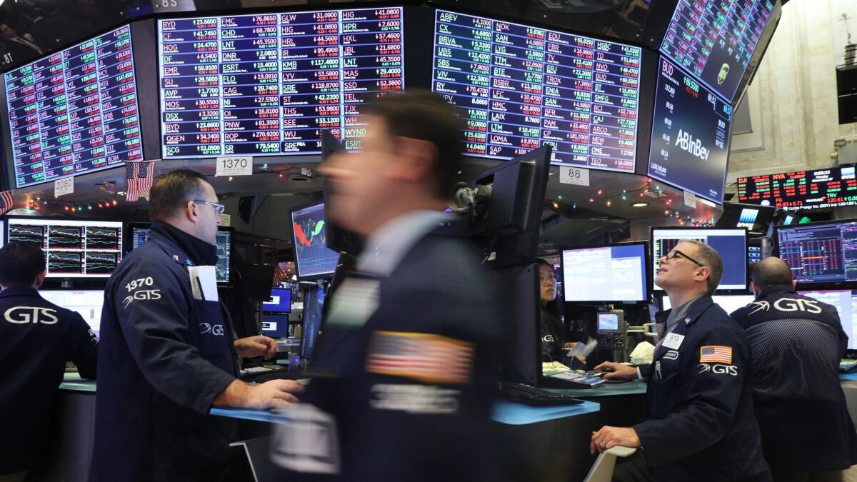 Traders work on the floor of the New York Stock Exchange.