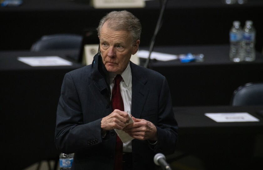 FILE - In this Jan. 8, 2021, file photo, Illinois House Speaker Michael Madigan appears on the floor as the Illinois House of Representatives convenes at the Bank of Springfield Center, in Springfield, Ill. House Speaker Madigan on Monday, Jan. 11, 2021, said he was “suspending” his campaign for a 19th term in the leadership post. Madigan, the longest-serving leader of a legislative body in U.S. history, issued a statement that began, “This is not a withdrawal.” But it urged House Democrats to “work to find someone, other than me, to get 60 votes for speaker.” (E. Jason Wambsgans/Chicago Tribune via AP File)