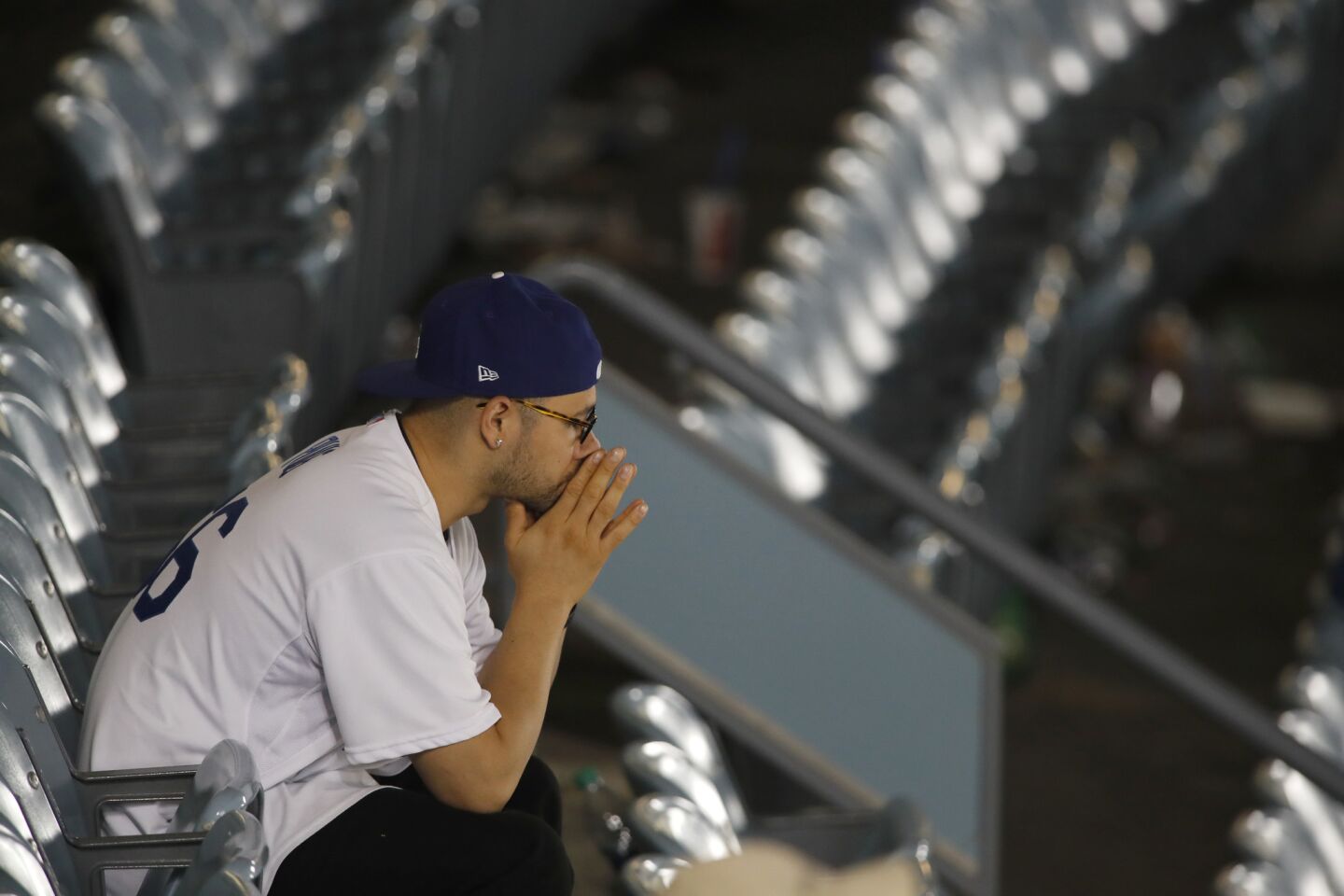 A lone Dodger fan watches the Houston Astros celebrate their 5-1 victory.