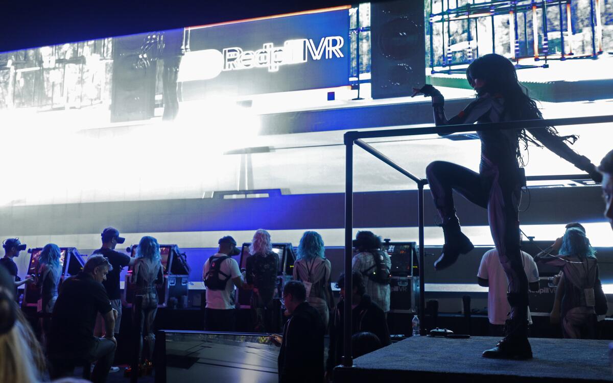Dancers perform at the Redpill VR and Sensorium area during E3 at the Los Angeles Convention Center.