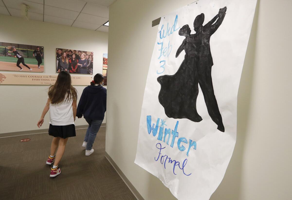 A poster advertising the winter formal in a hallway at JSerra Catholic High School.