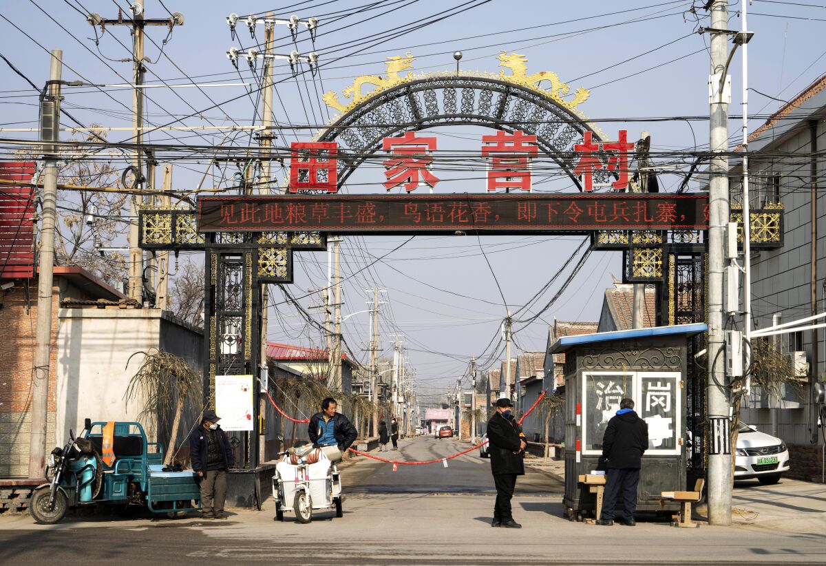 Entry to Tianjiaying village in the suburbs of Beijing is barred amid the spreading coronavirus.  
