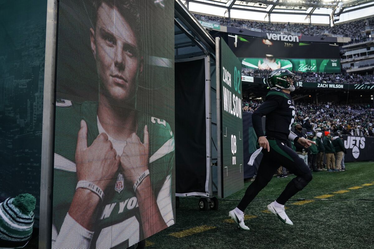 New York Jets quarterback Zach Wilson takes the field before the first half of an NFL football game against the Philadelphia Eagles, Sunday, Dec. 5, 2021, in East Rutherford, N.J. (AP Photo/Seth Wenig)