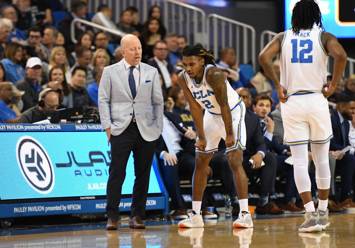 UCLA coach Mick Cronin talks to guard Dylan Andrews during a game against Arizona State on March 9.