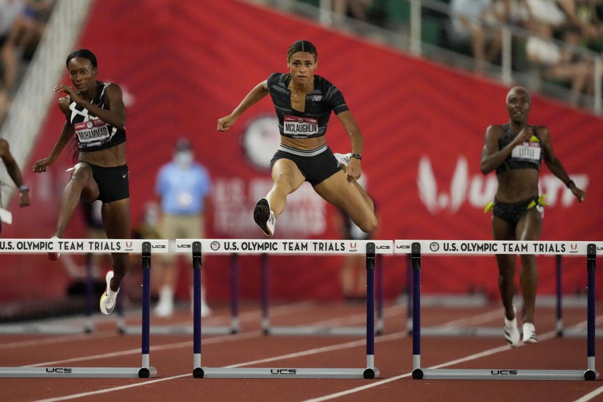Sydney McLaughlin sets a new world record in the finals of the women's 400-meter hurdles.