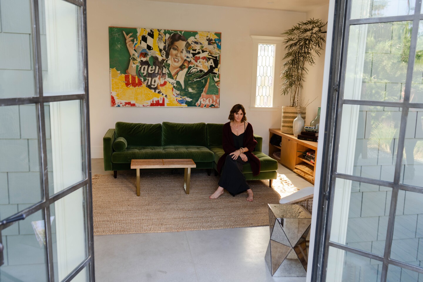 Actress Errin Hayes in the favorite room of her Highland Park home, a garage structure rehabbed into an entertainment room at the pool. Photographed Nov. 7, 2019. (Jesse Goddard / For The Times)