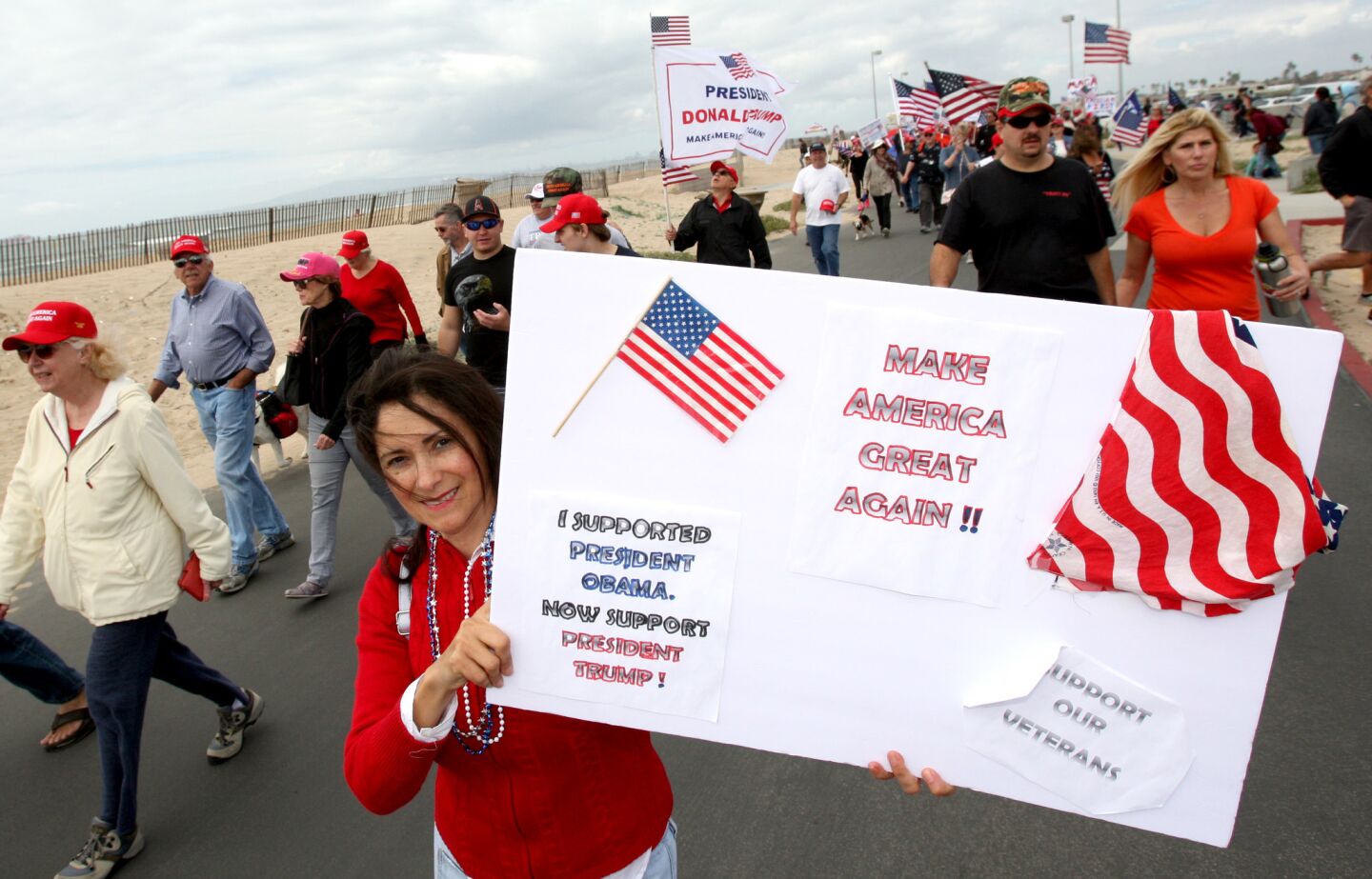 Theresa Melconian of Long Beach brought her own sign to the Make America Great Again March at Bolsa Chica State Beach on Saturday.