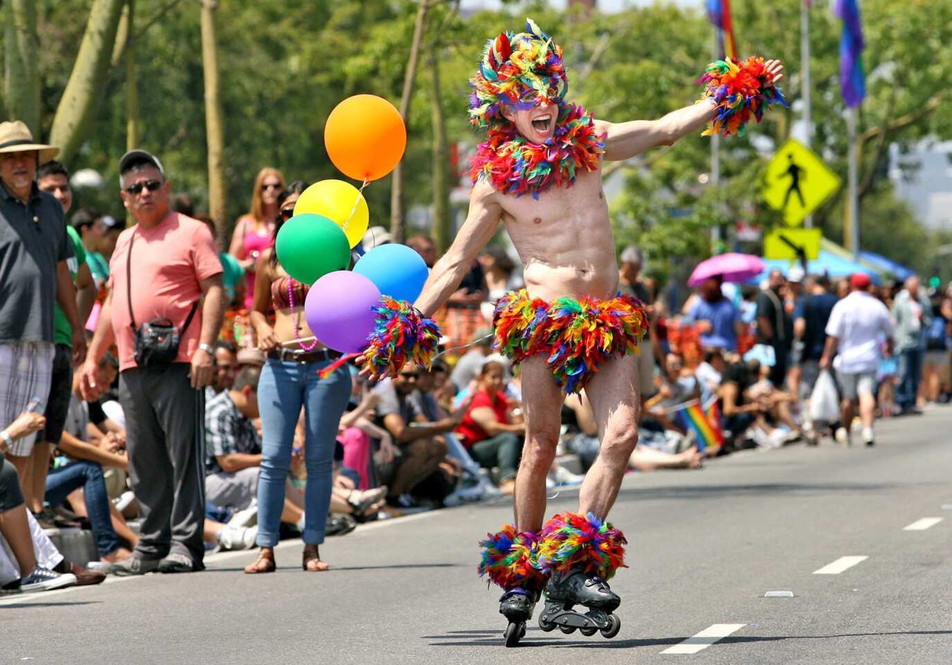 2012 L.A. Pride Parade: A parade participant entertains the crowd during the L.A. Pride Parade in West Hollywood on Sunday.