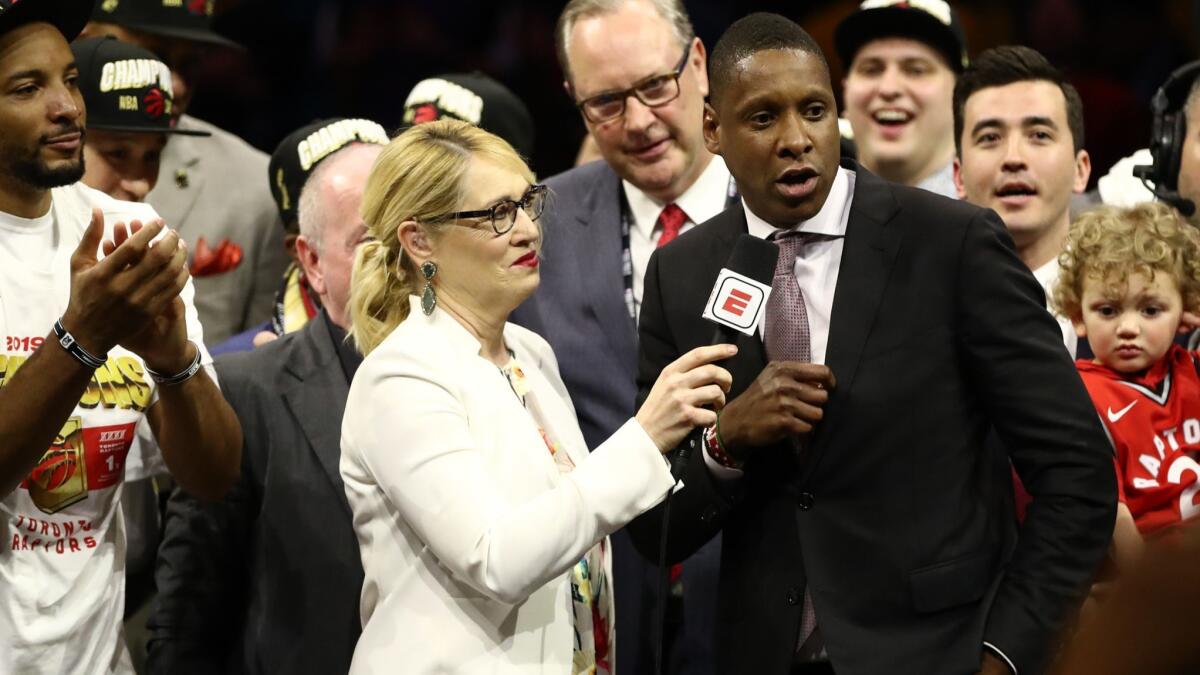 Toronto Raptors president Masai Ujiri is interviewed after his team's victory over the Golden State Warriors to clinch the NBA title Thursday at Oracle Arena in Oakland.