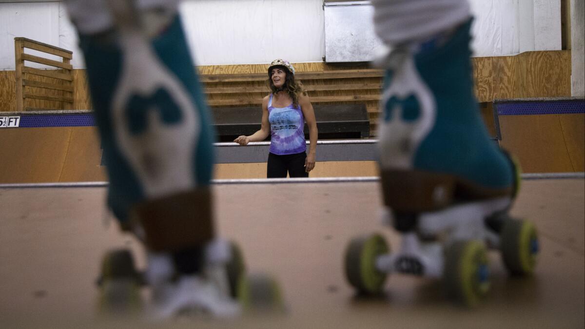 Michelle Steilen instructs students during a roller skating workshop at Camp Woodward in Tehachapi.