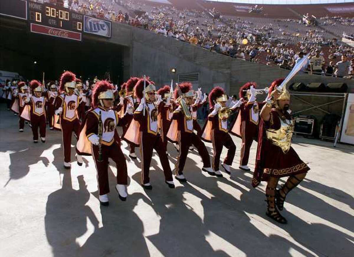 USC's Trojan marching band enter the Coliseum from the players tunnel.