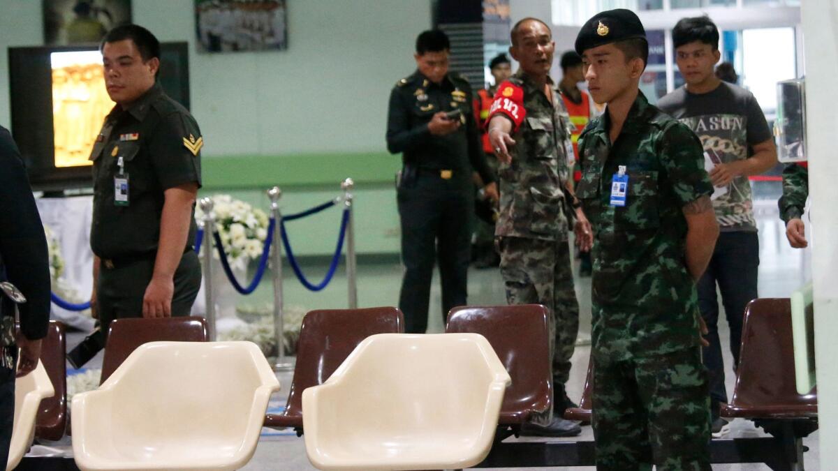 A Thai soldier stands guard in the lobby of Phramongkutklao Hospital in Bangkok after a bomb wounded more than 20 people on May 22.