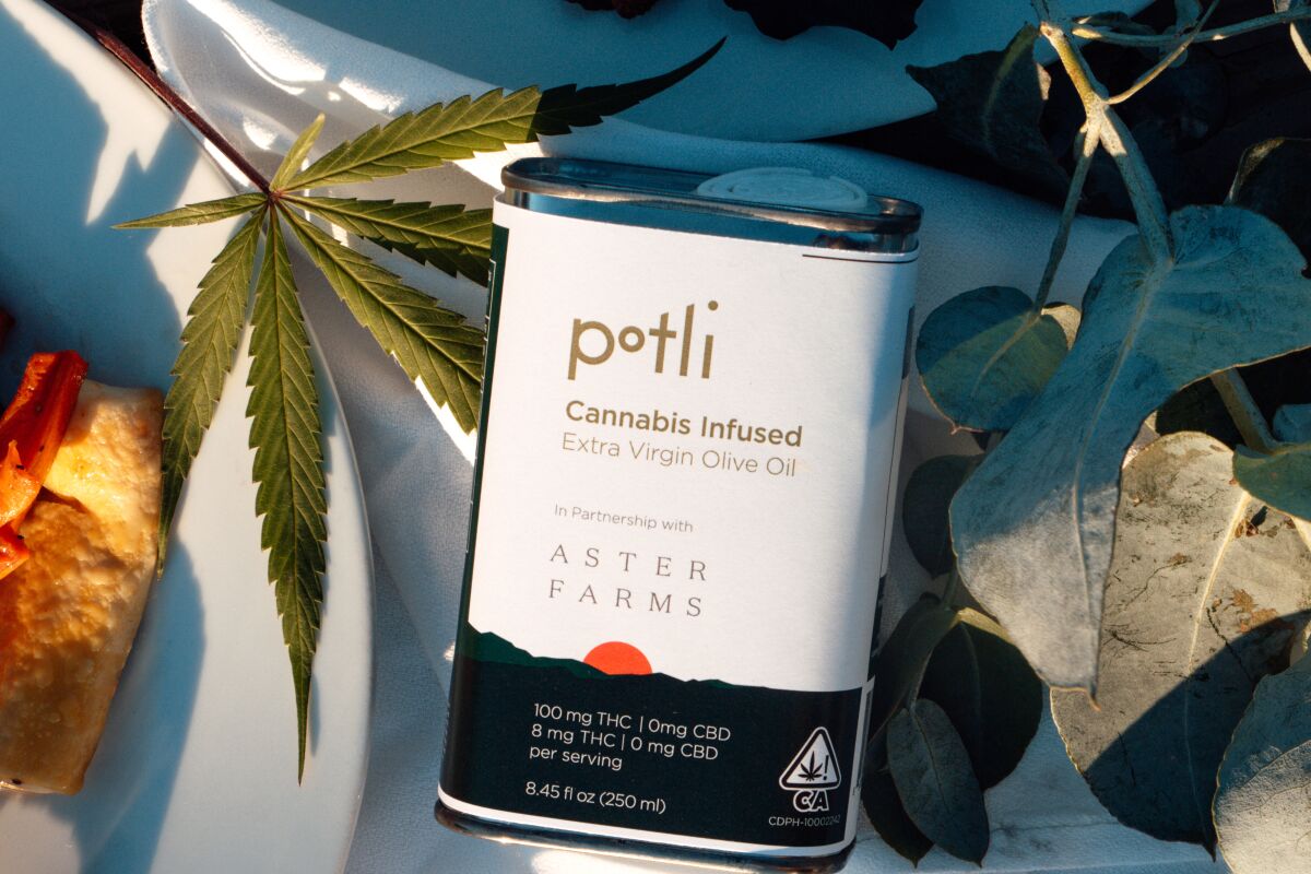 A metal tin filled with Potli X Aster Farms THC-infused olive oil