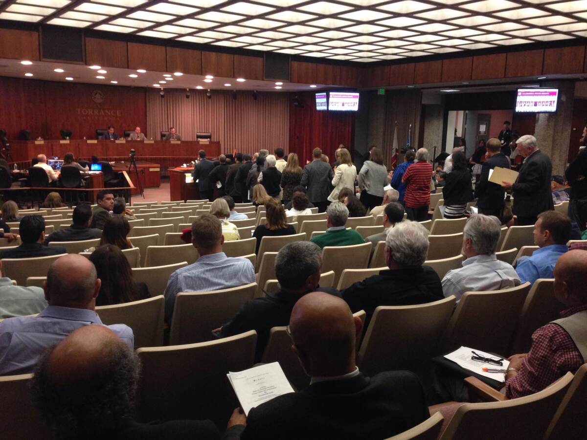 Dozens of audience members line up to speak during the public comment period. State senators held a hearing Thursday night about a Feb. 18 explosion at the Exxon Mobil refinery in Torrance.