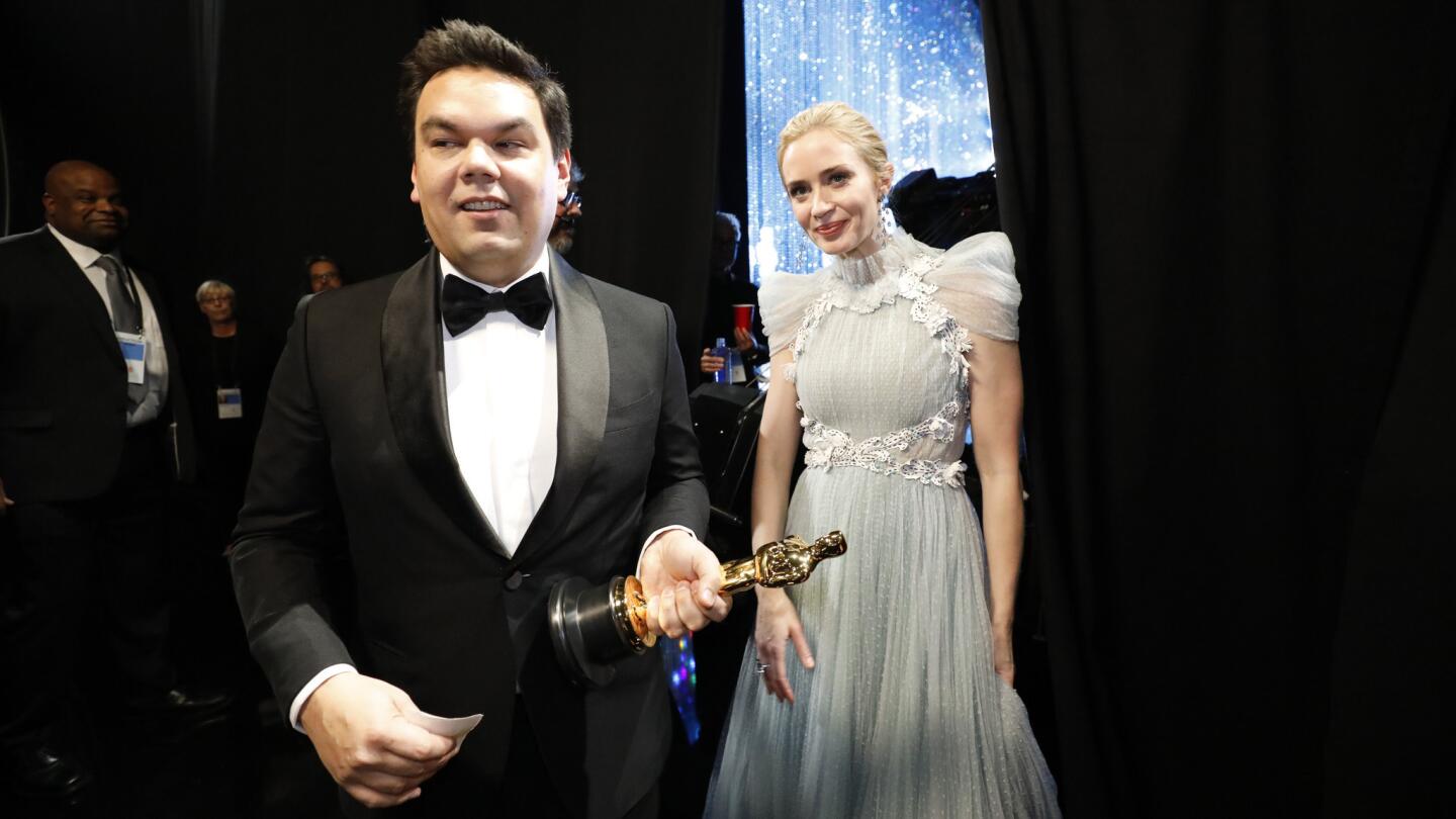 Robert Lopez and Emily Blunt backstage at the 90th Academy Awards on Sunday at the Dolby Theatre in Hollywood.