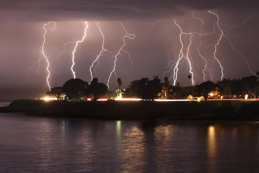 A rare lightning storm crackles over Mitchell's Cove in Santa Cruz, California around 3 a.m. Sunday morning August 16, 2020. The severe storm system rolled through the San Francisco and Monterey Bay areas early Sunday, packing a combination of dry lightning and high winds that triggered wildfires throughout the region. The National Weather Service on Sunday extended a red flag fire warning for the entire Bay Area until 11 a.m. Monday morning. (Shmuel Thaler/The Santa Cruz Sentinel via AP)