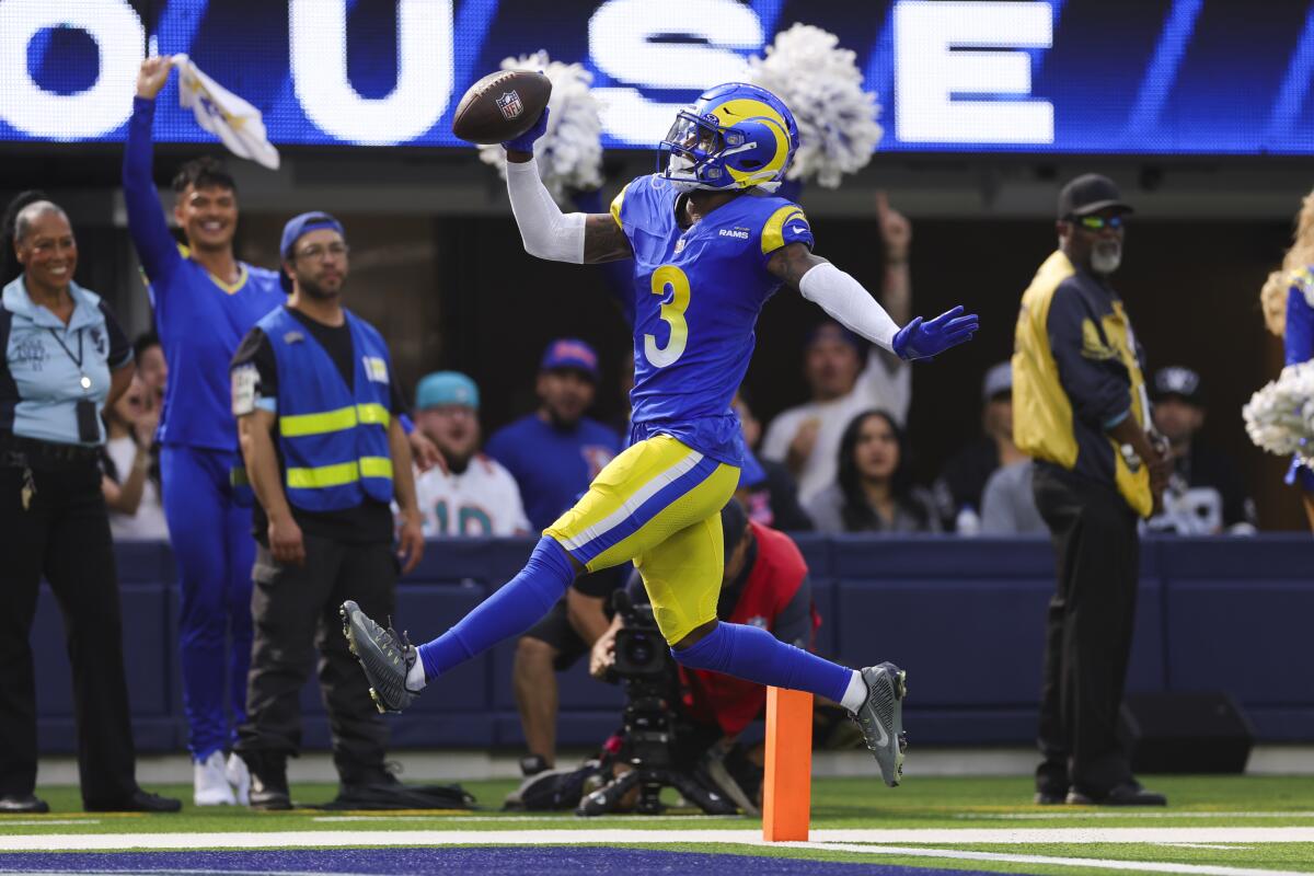 Rams safety Kam Curl celebrates after scoring a touchdown off a fumble in the second quarter Sunday.