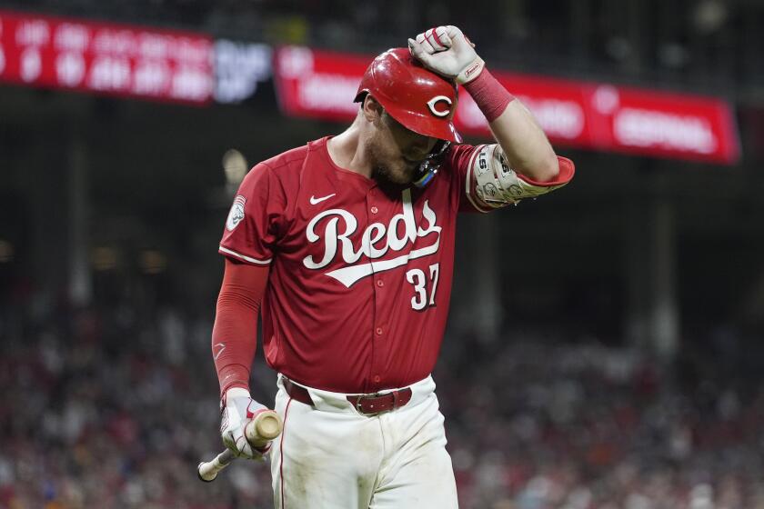Cincinnati Reds' Tyler Stephenson reacts after striking out in the seventh inning of a baseball game against the Baltimore Orioles, Saturday, May 4, 2024, in Cincinnati. The Orioles won 2-1. (AP Photo/Carolyn Kaster)