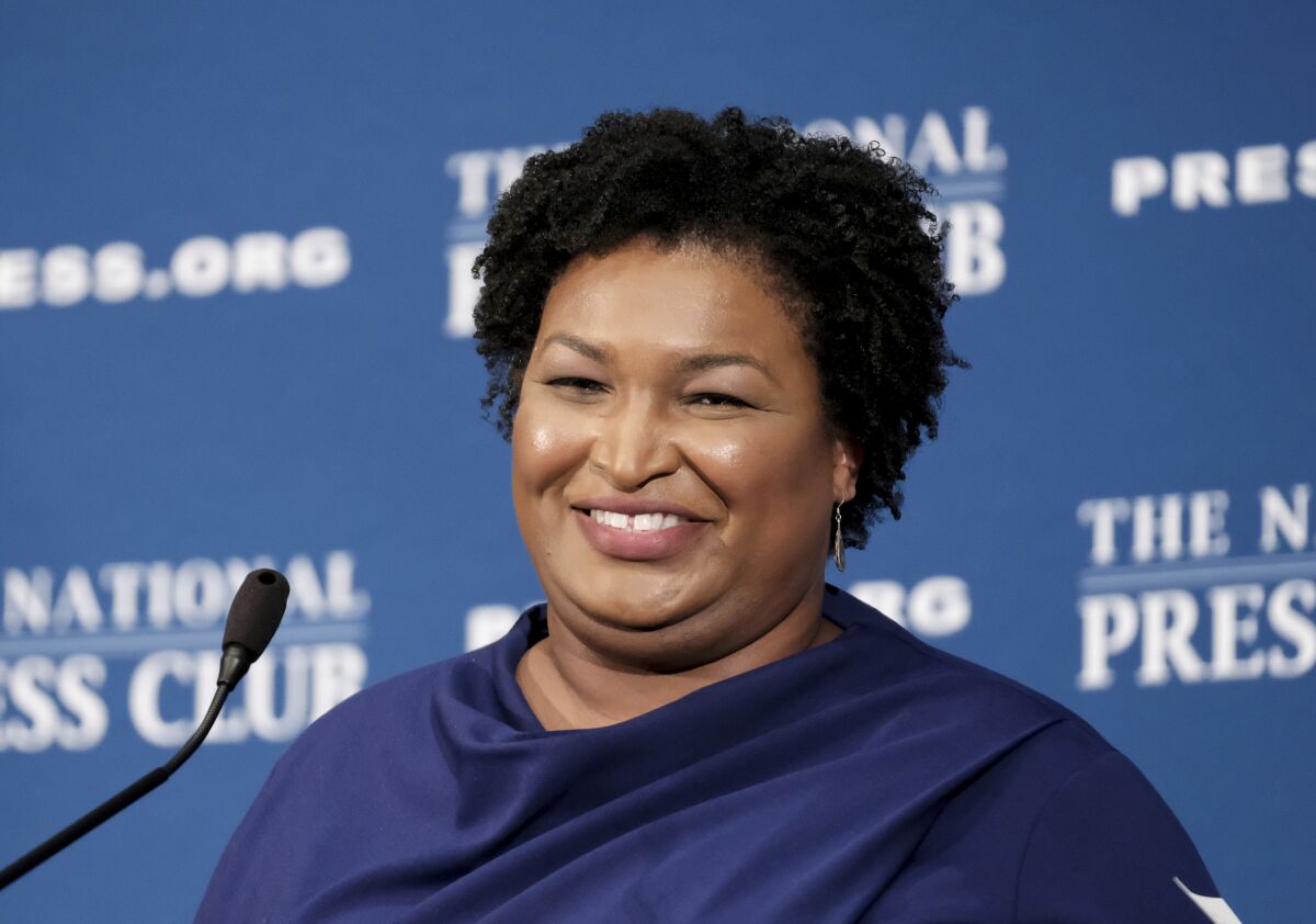 FILE - In this Nov. 15, 20-19 file photo, former Georgia House Democratic Leader Stacey Abrams, speaks at the National Press Club in Washington. A voting rights group founded by Democrat Stacey Abrams filed an emergency motion Monday, Dec. 16, 2019 asking a court to halt Georgia’s planned mass purge of voters. The motion was filed by Fair Fight Action in U.S. District Court, just hours before the secretary of state’s (AP Photo/Michael A. McCoy, File)