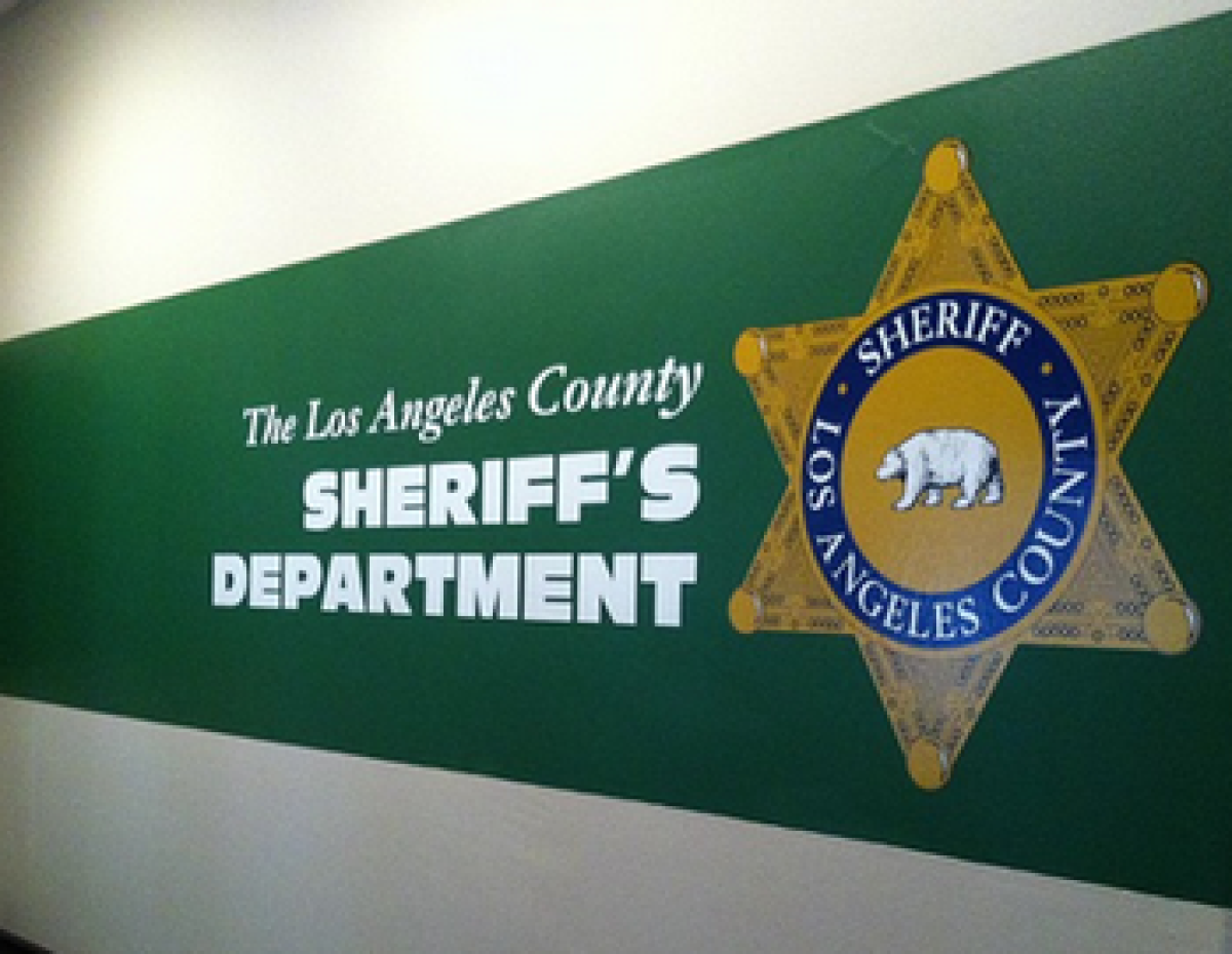The logo of the L.A. County Sheriff's Department on a wall.