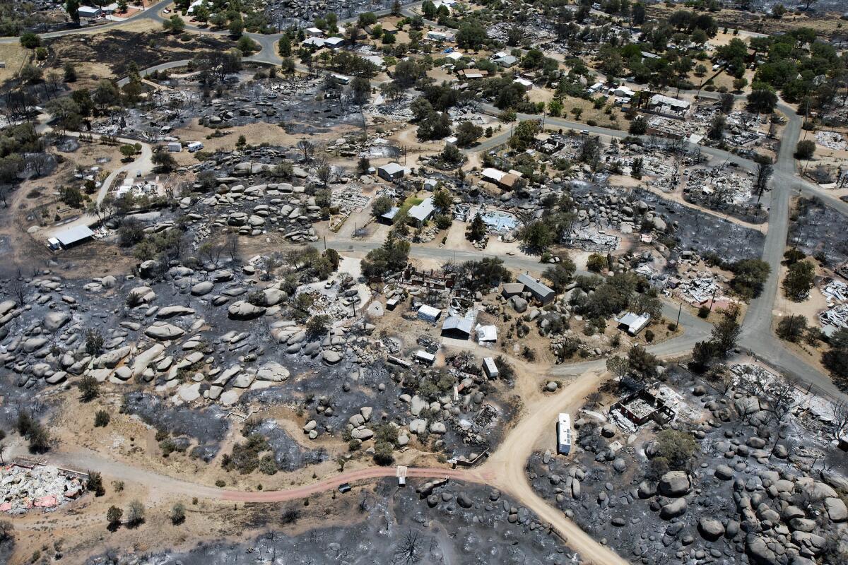 A section of Yarnell, Ariz., after the wildfire last month that claimed the lives of 19 members of an elite firefighting crew.
