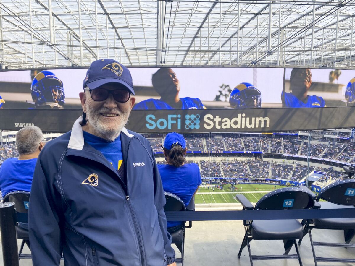 Lewis Lazarus, 91, attends a game at SoFi Stadium.