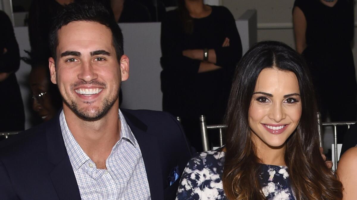 Josh Murray and Andi Dorfman of "The Bachelorette," shown at New York Fashion Week last October, have broken up.