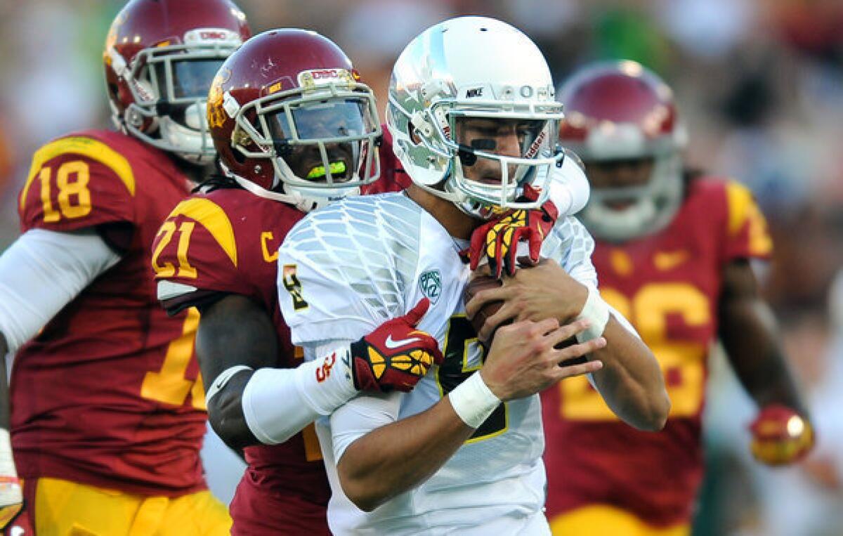 Quarterback Marcus Mariota and the Ducks were able to stay well ahead of USC in a 62-51 victory on Saturday night at the Coliseum.