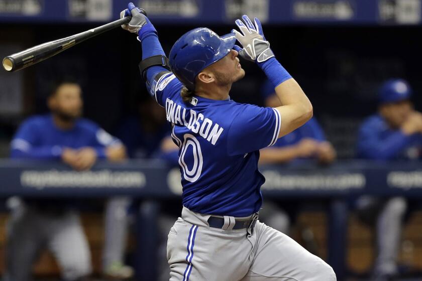Blue Jays third baseman Josh Donaldson watches his three-run home run against the Rays on Wednesday.