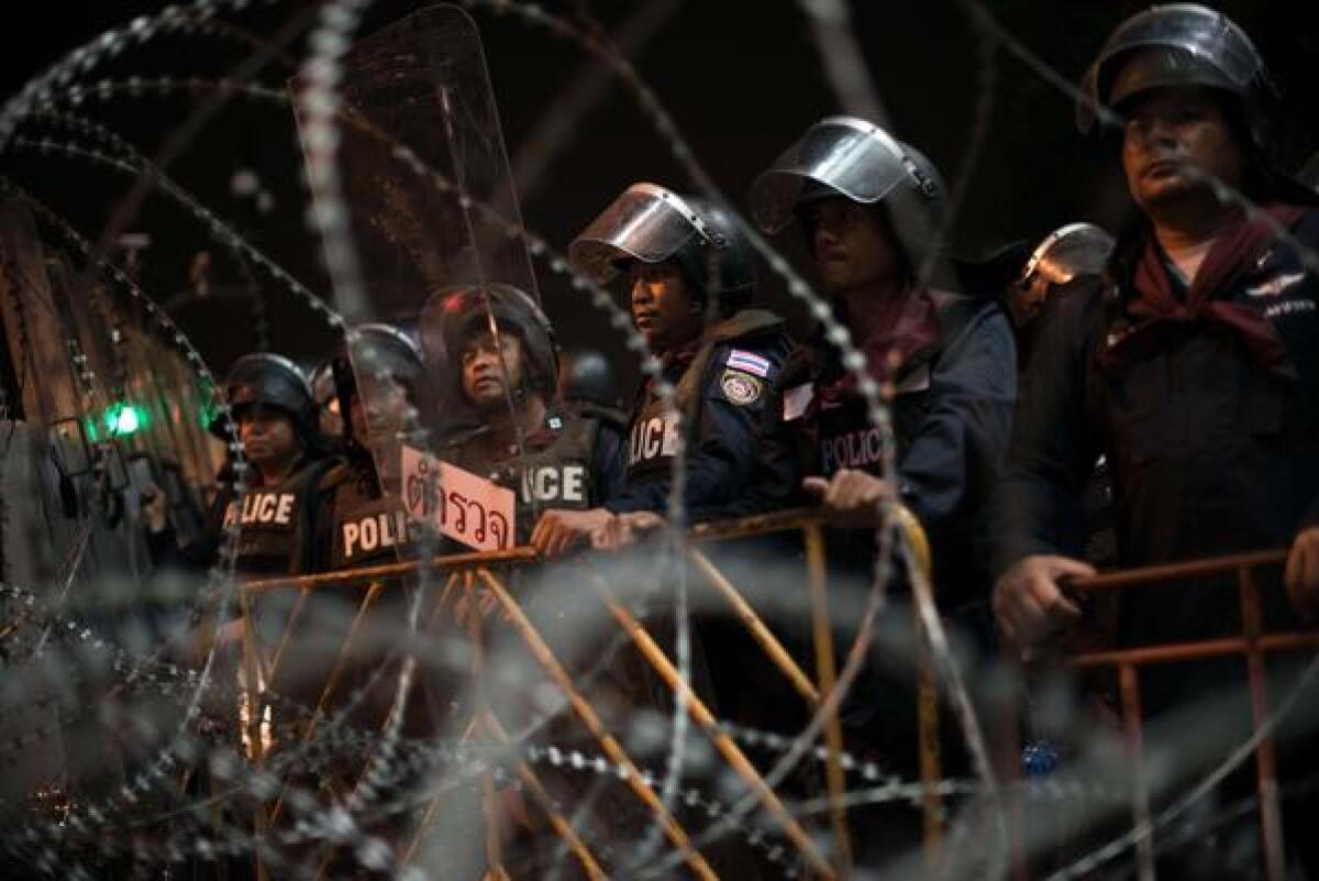 Thai riot police in Bangkok gird for clashes with anti-government protesters following Monday's decision by the International Court of Justice that the flashpoint border lands around the Preah Vihear temple belong to Cambodia. The decision fuels nationalist hostility toward an amnesty bill being debated in the Thai Senate that could allow exiled former Prime Minister Thaksin Shinawatra to return and make a political comeback. Thai nationalists accuse Thaksin of failing to defend Thai sovereignty over disputed territory.