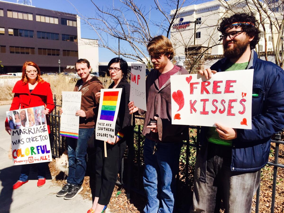 A group from the University of West Florida rallies in support of same-sex marriage outside the U.S. District Courthouse in Mobile, Ala.