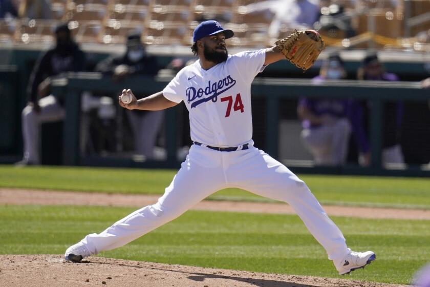 Dodgers reliever Kenley Jansen pitches against the Colorado Rockies during a spring training game March 1 in Phoenix.