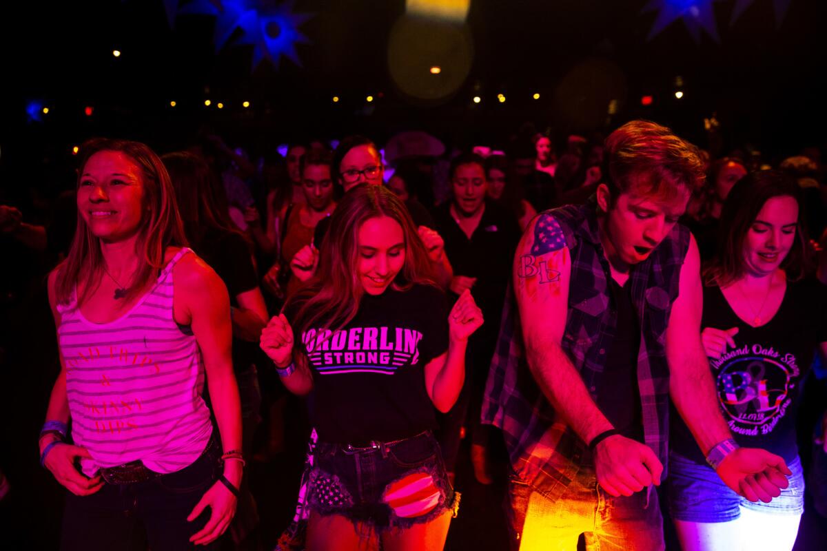 People line dance at Borderline Country Night at The Canyon bar in Agoura Hills.