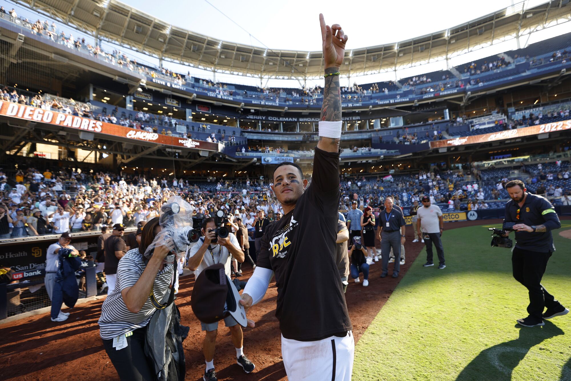  San Diego Padres' Manny Machado celebrates on the field after the team clinched a wildcard playoff spot
