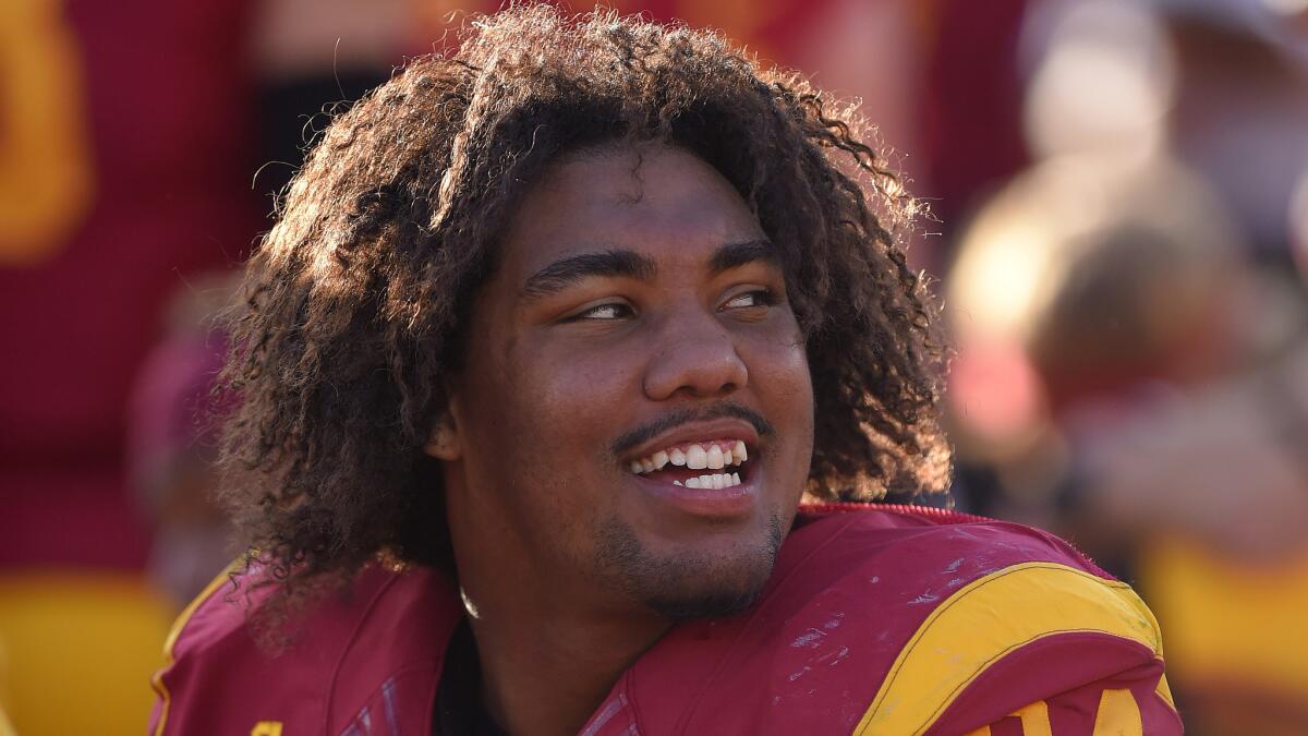 USC defensive end Leonard Williams looks on from the bench during the Trojans' 49-14 win over Notre Dame on Nov. 29, 2014.