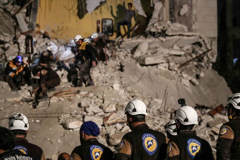 Mandatory Credit: Photo by MOHAMMED BADRA/EPA-EFE/REX/Shutterstock (9767460b) (FILE) - Volunteers of White Helmets search for survivors after an explosion in the city of Idlib, Syria, 09 April 2018, (reissued 22 July 2018). Media reports on 22 July 2018 state that around 800 White Helmets personnel and their families have been evacuated to Jordan via Israel, The Israel Defense Forces said. The White Helmets are a Syrian Civil Defence volunteer organisation. Volunteers of White Helmets evacuated to Jordan via Israel, Idlib, Syria - 09 Apr 2018 ** Usable by LA, CT and MoD ONLY **