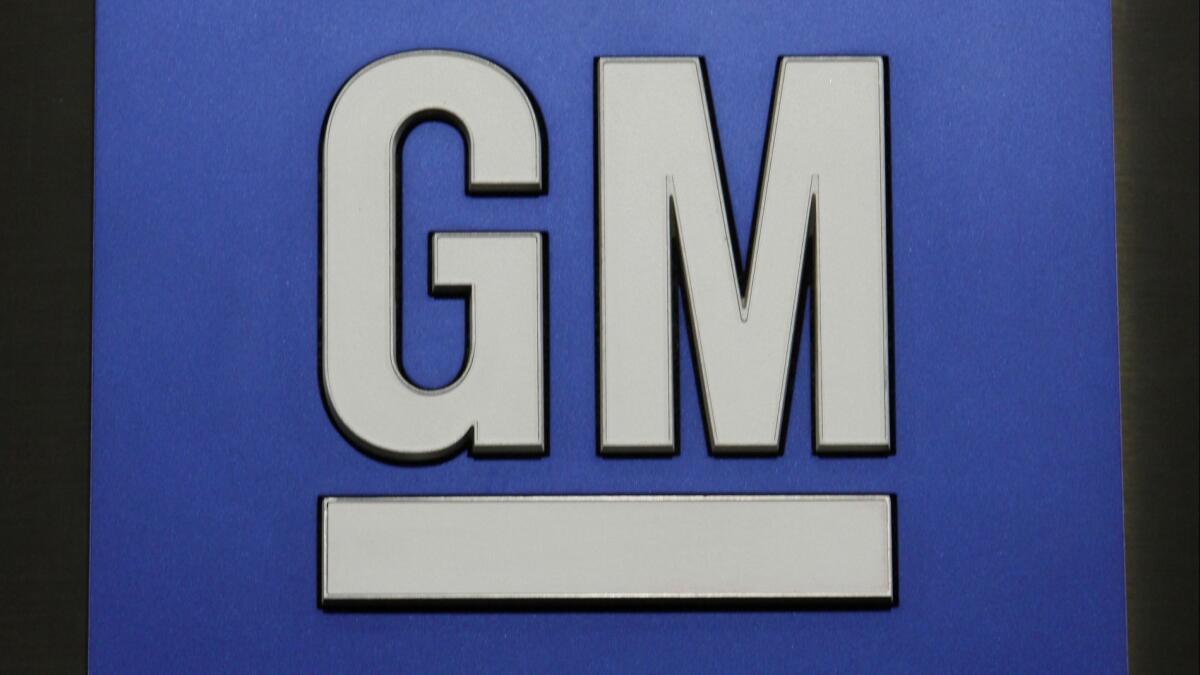 The General Motors logo displayed at a news conference in Detroit.