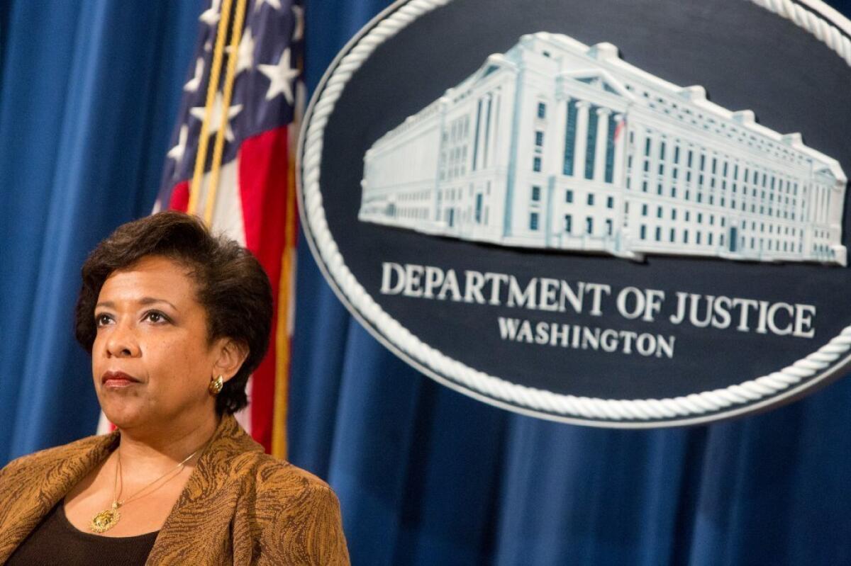 Attorney General Loretta E. Lynch listens at a press conference on June 22, 2016 in Washington, DC. Lynch and other government officials announced the result of a national Medicare fraud crackdown that took place in 36 districts around the country.