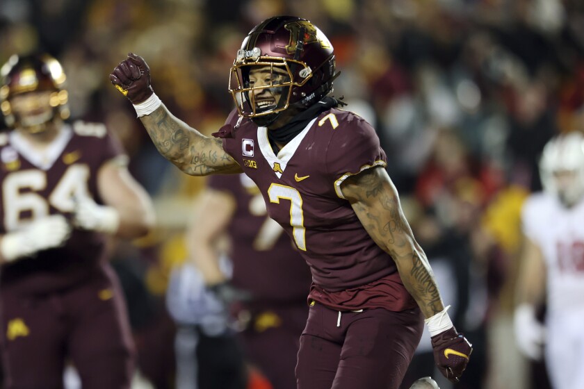 Minnesota wide receiver Chris Autman-Bell (7) reacts after scoring a touchdown against Wisconsin during the second half of an NCAA college football game Saturday, Nov. 27, 2021, in Minneapolis. (AP Photo/Stacy Bengs)