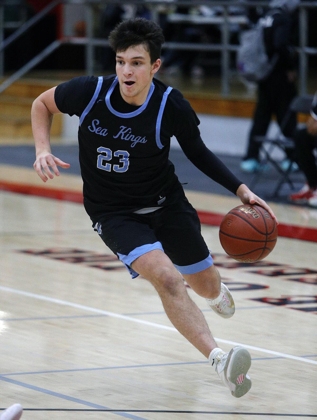 Corona del Mar's Jack Stone, pictured driving to the basket against Whittier on Dec. 4, 2019, helped the Sea Kings beat Cabrillo 89-49 on Monday.