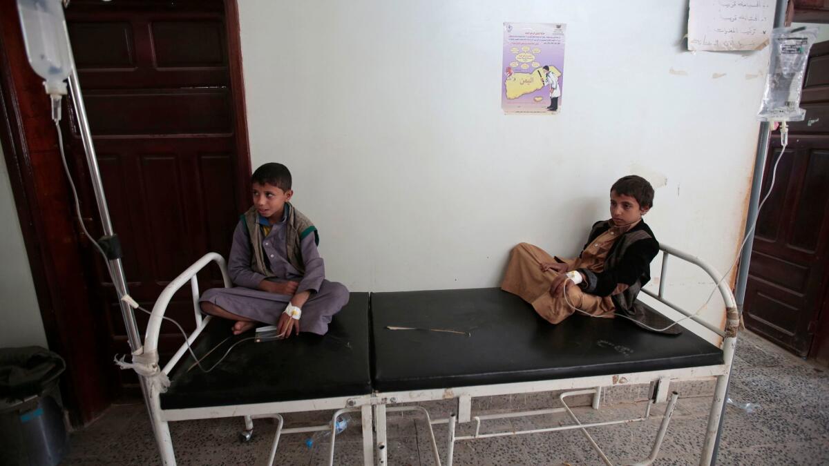 Boys are treated for a suspected cholera infection at a hospital in the Yemeni capital, Sana.