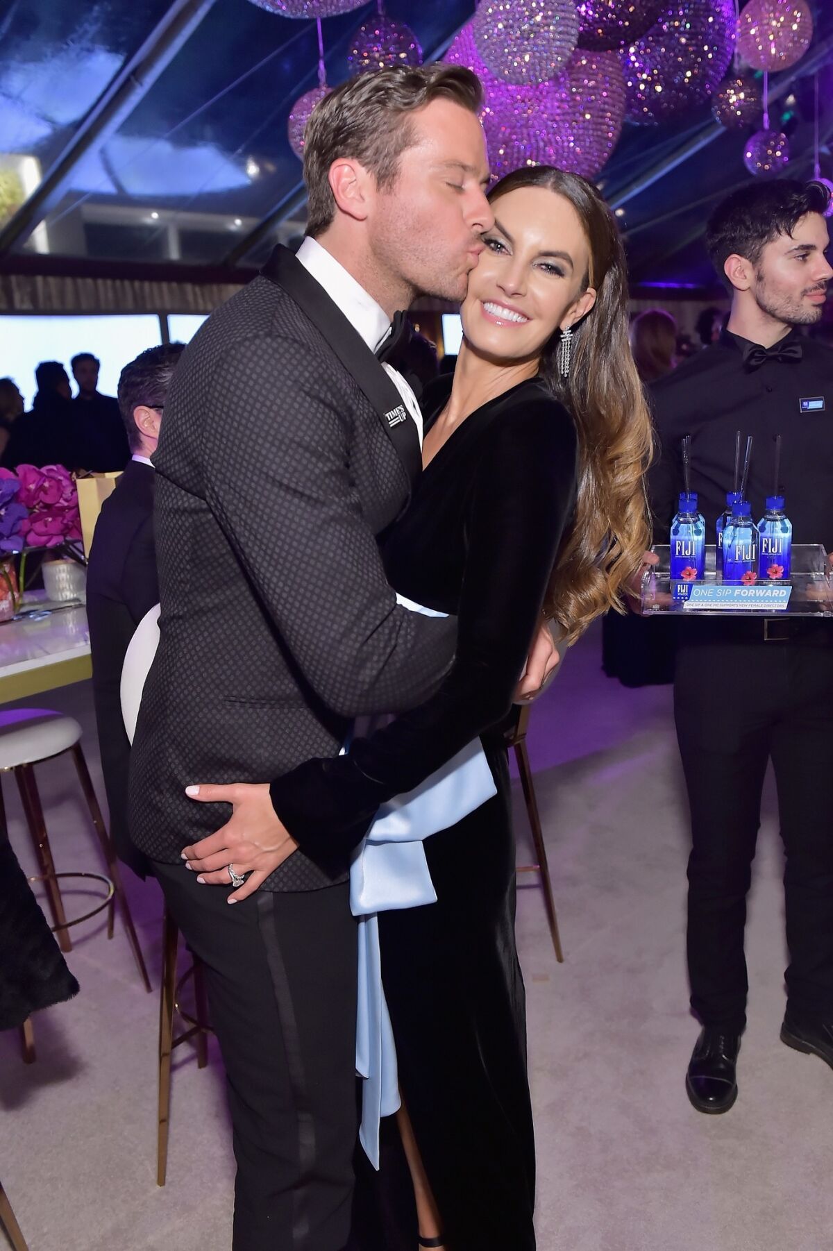 Armie Hammer, left, and Elizabeth Chambers share a moment at the HFPA's viewing and after-party at the Wilshire Garden inside the Beverly Hilton on Sunday.