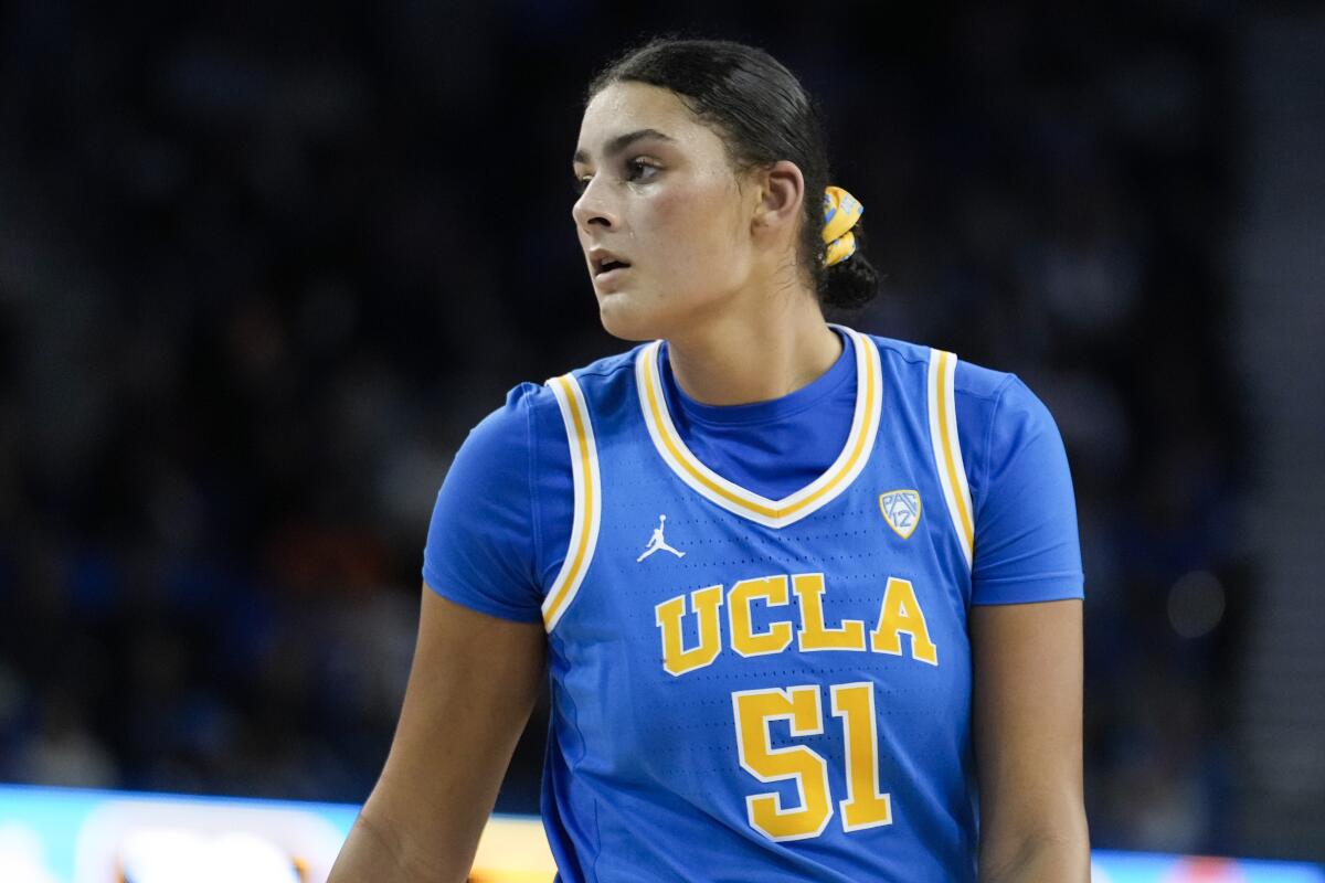 UCLA center Lauren Betts stands on the court during a game against USC.
