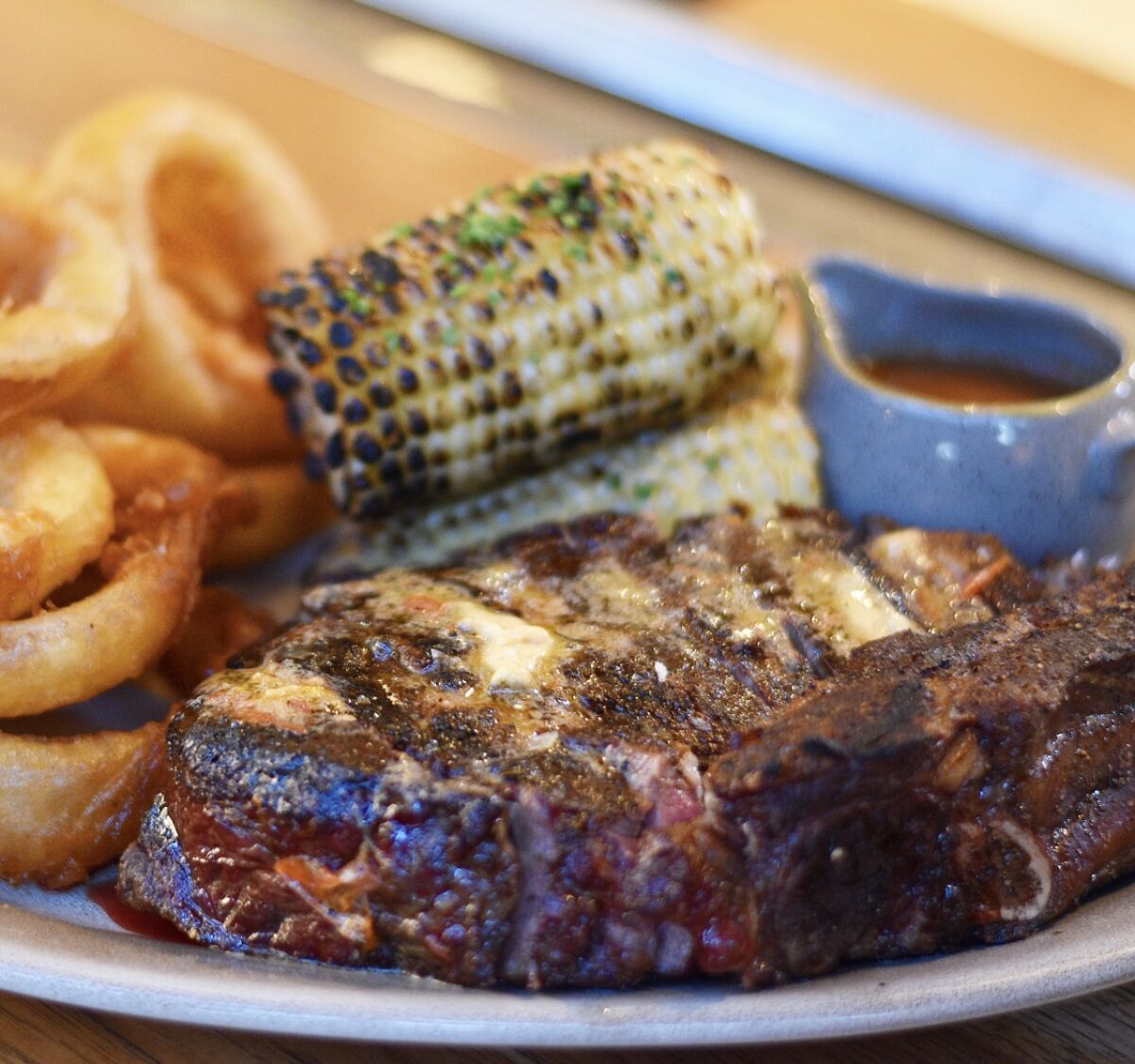 A 34-ounce dry-aged ribeye steak dinner for two at Juniper and Ivy restaurant.