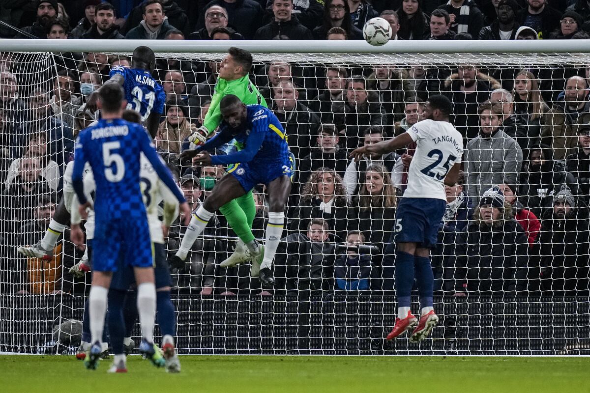 Chelsea's Antonio Rudiger, center and foreground, scores the opening goal during the English League Cup semifinal second leg soccer match between Tottenham Hotspur and Chelsea at the Tottenham Hotspur Stadium in London, Wednesday, Jan. 12, 2022. (AP Photo/Alastair Grant)