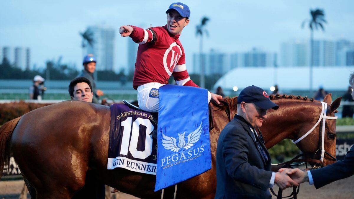 Jockey Florent Geroux reacts after riding Gun Runner to win the Pegasus World Cup.