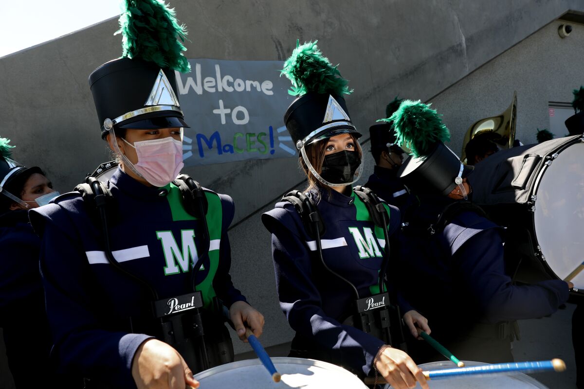 Band members at the Maywood Center for Enriched Studies wear masks.