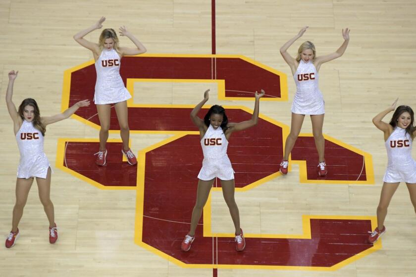 General overall view as Southern California Trojans song girls cheerleaders dance on the SC logo at midcourt during an NCAA basketball game against the Long Beach State 49ers in Los Angeles, Nov 28, 2018. (Kirby Lee via AP)